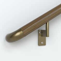 a close up of a wooden door handle with a metal object in the foreground