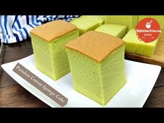 three pieces of green cake sitting on top of a white plate next to each other