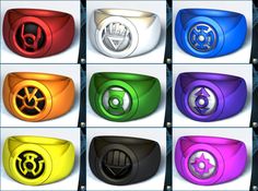 six different colored rings with an emblem on each one and the other in black, white, yellow, red, blue, green, purple, orange