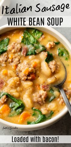 a bowl of italian sausage and white bean soup with a spoon in it on a table