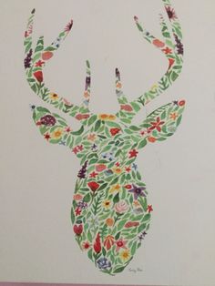 an image of a deer with flowers on it's antlers