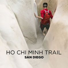 a man climbing up the side of a snow covered mountain with text reading ho chi minh trail san diego