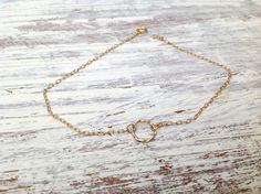 "This tiny gold circle bracelet is a delicate bracelet made with a beautiful 14k gold filled circle tiny ring connector . It is a tiny, delicate and dainty bracelet. This romantic gold bracelet is perfect for giving to a special someone or as a gift to yourself. You can wear the bracelet on the arm or leg. Made from 14k goldfilled (chain and pendant). Bracelet Measures Approximately 7\"- as default Please select a size from the options If you would like this chain altered, please convo me . All Dainty Jewelry With Delicate Open Circle Chain, Dainty Open Circle Jewelry With Delicate Chain, Dainty 14k Gold Filled Circular Jewelry, Dainty 14k Gold Open Circle Jewelry, Dainty 14k Gold Full Circle Jewelry, Dainty Delicate Chain Jewelry, Hypoallergenic Dainty Open Circle Jewelry, Handmade Dainty Circle Jewelry, Handmade Dainty Circular Jewelry