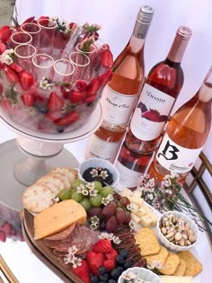 wine and cheese platter with strawberries, raspberries, grapes, crackers