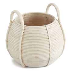 a white basket with handles is shown on a white background