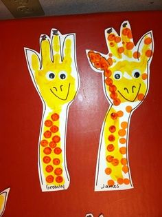 two giraffes made out of construction paper