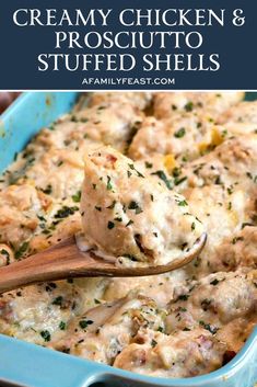 creamy chicken and prosciutto stuffed shells in a blue casserole dish with a wooden spoon