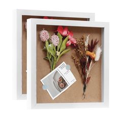 two framed pictures with flowers and an envelope