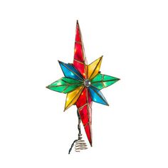 a multicolored glass star ornament hanging from a wire