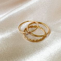 14k gold filled - Hypoallergenic - Waterproof- Made To Last. 3 separate 14K gold filled stacking rings sold as a set. You will receive: 1 gold filled stacker 1 Petite Cz Ring 1 Twist Eternity Ring $95 value! 14k Gold Hypoallergenic Stackable Rings For Promise, Gold Plated Stackable Rings For Everyday, Gold Stackable Midi Rings In Recycled Material, Stackable 14k Gold Filled Rings For Promise, Gold Stackable Midi Rings, Dainty Gold Stackable Rings In Recycled Gold, Stackable 14k Gold Filled Rings, Everyday Gold Plated Stackable Rings With Round Band, Stackable Crystal Ring In 14k Rose Gold