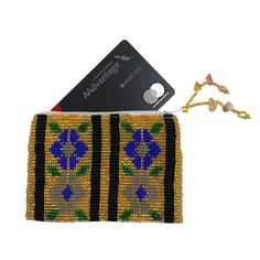 Beautifully hand-loomed of solid Czech seed beads, this charming coin purse makes a great gift. Each coin purse is fabric-lined with a zipper closing. The coin purses are hand-loomed by artisans in Guatemala and imported with Fair Trade practices. Perfect for holding ID/Credit Cards.* 4.5 in x 3 in x 0.25 in* Handmade in Guatemala* Made following Fair Trade guidelines Beaded Coin Purse, Coin Purses, Hand Loom, Small Flowers, Beaded Flowers, Brown Gold, Guatemala, Credit Cards, Fair Trade