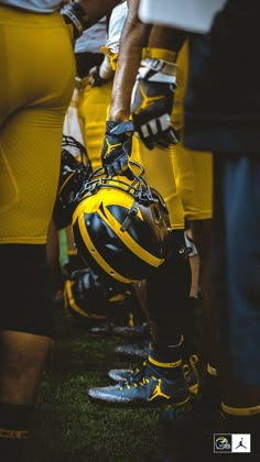 a group of football players standing next to each other