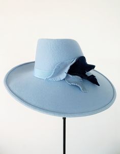 "Blue wide brim \"Josephine\" hat is part of Elena Shvab Millinery A/W 2018-2019 collection.  The hat is made of wool felt and handcrafted in our London based studio. Decorated with hand shaped felt decor and a matching hatband.  The hat could be made in various colors to match your outfit. Please contact for more details. The hat size available, please chose at the checkout: S - 55 cm, 6 3/4 (UK size), 6 7/8 (USA, Canada size) M - 56 cm, 6 7/8 (UK size), 7 (USA, Canada size) L - 57 cm, 7 (UK size), 7 1/8 (USA, Canada size) How to measure your head size: Measure circumference of head just above top of ears. Wrap tape gently around head making certain tape lies midway on your occipital bone (that little bump in the middle of the back of your head). Don't pull the tape too tightly or your ha Felt Decor, Church Lady Hats, Felt Leaves, Wide Brim Fedora, Felt Decorations, Hand Shapes, Wide Brimmed Hats, Hat Band, Brim Hat