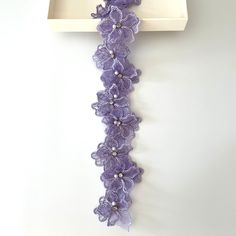 a white tray with purple flowers on it