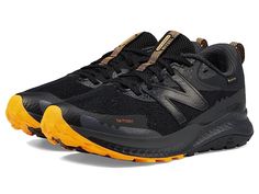 New Balance Dynasoft Nitrel v5 GTX - Men's Shoes : Black/Vibrant Apricot : Predecessor: Dynasoft Nitrel v4 GTX Explore the untouched beauty of nature at high altitudes wearing the New Balance Dynasoft Nitrel v5 GTX Trail Running Shoes. Featuring a GORE-TEX waterproof fabric construction, these sneakers offer protection from rain and have a DynaSoft midsole foam for ultra-responsive performance. Synthetic and mesh upper. Textile lining and insole. Lace-up closure. Padded collar and tongue. Pull t New Balance Dynasoft, Mens New Balance, Mens Shoes Black, Fabric Construction, New Balance Men, Trail Shoes, Kids Luggage, Trail Running Shoes, Waterproof Fabric