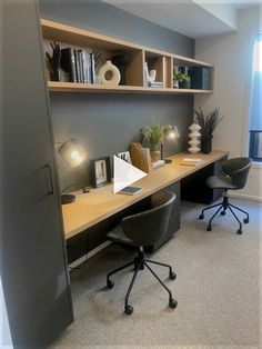 an office with a desk, chair and bookshelf