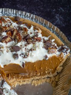 there is a pie with nuts and cream on it