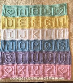 a crocheted blanket that has been made to look like it is in different colors