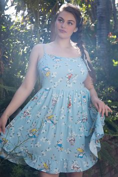 Need a dress for a very sunny, golden afternoon? Go out for a picnic with Dinah in this light blue dress. It has a tiered design with adjustable straps and an allover print of white daisies, the White Rabbit and Alice. Alice In Wonderland Floral, Golden Afternoon, Plus Size Disney, Disney Alice In Wonderland, The White Rabbit, Light Blue Dress, Disney Bound Outfits, White Daisies, Light Blue Dresses