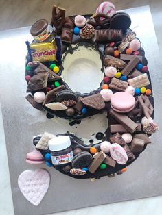 a chocolate cake decorated with candies, marshmallows, and other sweets