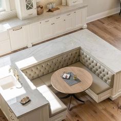 an overhead view of a living room and kitchen