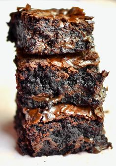 three chocolate brownies stacked on top of each other