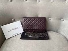 Overview Chanel Wallet on Chain in Aaubergine Lambskin Leather with Dark Silver Hardware. The ultimate evening style, the classic Chanel WOC is timeless and features the CC hardware detailing on the front flap. Lambskin leather is luxurious and soft in texture. Perfect for evening wear or night out to carry the essentials. Can be carried as a handheld clutch with the chain tucked inside, or over shoulder or cross body. Lovely dark purple shade. Features Aubergine Lambskin Leather Silver toned ha Chanel Wallet On Chain, Chanel Woc, Classic Chanel, Evening Style, Wallet On Chain, Chanel Wallet, Leather Silver, Fendi Bags, Chain Bags