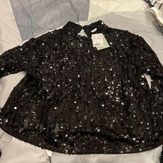 Size Medium Black Sequence Top Buttons At Neck. Fits Loose At 5 .1 Foot 148. New With Tags . Fits At The Hip Line . Black Sequin Blouse For Date Night, Casual Party Blouse With Sequins, Long Sleeve Sequin Blouse For Date Night, Sequin Long Sleeve Blouse For Date Night, Black Sequined Tops For Spring, H&m Trendy Long Sleeve Blouse, Trendy H&m Long Sleeve Blouse, Trendy Long Sleeve H&m Blouse, H&m Casual Blouse For Night Out