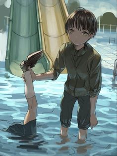 a boy is standing in the water with a book on his shoulder and another person holding an umbrella