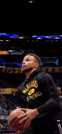 a man holding a basketball in his right hand