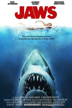 a movie poster for jaws with a shark in the water