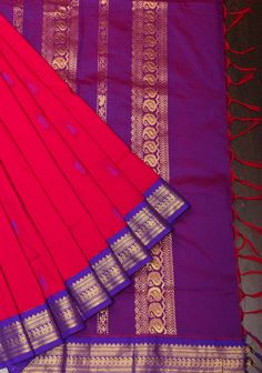 Discover timeless elegance with this Red Tone Cotton Silk Saree, a masterful blend of vibrant color and intricate craftsmanship. The saree features a rich red hue that exudes warmth and sophistication, making it a striking choice for a variety of occasions. Crafted from a luxurious cotton-silk blend, it offers a smooth and comfortable drape, combining the best qualities of both fabrics. Adorned with delicate thread buttas, the saree showcases intricate patterns that add subtle texture and visual interest to the fabric. These thread buttas enhance the overall design with their refined artistry, creating a beautifully detailed look. The saree is framed by exquisite purple zari borders, which introduce a regal contrast with their shimmering golden threads. The purple zari border adds depth an Silk Saree Border Designs, Saree Border Designs, Red Tone, Cotton Silk Saree, Saree Border, Subtle Textures, Intricate Patterns, Salwar Kameez, Cotton Silk