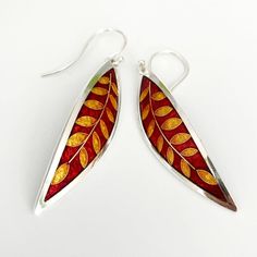 Ruby Red and GOLD Laurel Leaf Earrings – Cloisonné and Champlevé Enamels on Fine Silver 24k Gold Wires w Sterling Ear Wires by Sandra McEwenMaterials: Champlevé & cloisonné Enamels on Fine silver.EarringsSize: 2” long x .5” wideDid you know that enamels are melted glass?  Yes!  It's true...  To create this lovely pair of earrings, I first fabricated the silver base out of sheets of fine silver.  The lines of the design are actually fine silver wires that I meticulously bent by hand (and twee Red Hand Painted Sterling Silver Jewelry, Elegant Hand Painted Gold Jewelry, Elegant Red Earrings For Ceremonial Occasions, Gold Hand-painted Teardrop Earrings, Gold Teardrop Earrings Hand Painted, Red Polished Earrings For Gift, Traditional Polished Earrings As Gift, Traditional Polished Earrings For Gift, Gold Hand Painted Teardrop Earrings