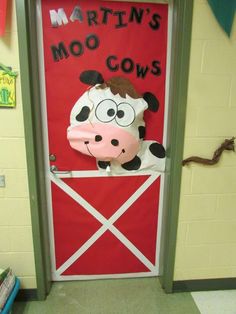 a door decorated to look like a cow with the words martin's moo cows on it