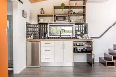 the kitchen is clean and ready to be used as a dining room or office space