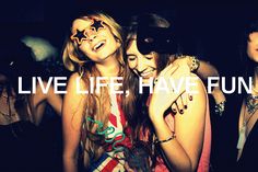 two girls standing next to each other with the words live life home fun on them