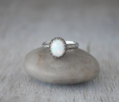 Oval Opal Ring Sterling Silver Handcrafted by PrairieCoastArt Sterling Silver Opal Ring With Bezel Setting For Wedding, Wedding Opal Ring In Sterling Silver With Bezel Setting, Wedding Opal Ring With Bezel Setting In Sterling Silver, Unique Oval Jewelry With Halo Setting, Handmade Oval Opal Ring For Wedding, Handmade Oval Opal Wedding Ring, Wedding Jewelry With Bezel Setting And Oval Cabochon, Wedding Jewelry With Bezel Set Oval Cabochon, Sterling Silver Opal Ring For Wedding, Oval Cabochon