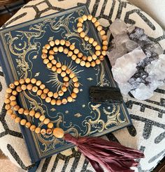 This mala is made of 7-8mm sustainably sourced Palo Santo wood. It's hand knotted between each bead on a brown nylon cord and is finished with a Palo Santo guru bead and your choice of tassel. This mala is made to order and will be similar but vary slightly from the one shown based on the uniqueness of the wood. This is not meant to take the place of medical advice. Please consult your doctor should you feel you need support Natural Wooden Beads Necklace For Meditation, Spiritual Necklace With Natural Wooden Beads, Artisan Hand-knotted Beaded Necklaces For Meditation, Spiritual Natural Beaded Necklaces As Gift, Spiritual Natural Beaded Necklace Gift, Spiritual Style Natural Beaded Necklace Gift, Gift Brown Hand Knotted Mala, Brown Hand Knotted Mala As Gift, Brown Hand-knotted Mala As Gift