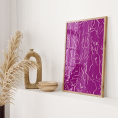 there is a purple painting on the wall next to a vase and a wooden bowl