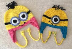 two crocheted hats with eyes on them