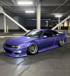 a purple car parked in a parking garage