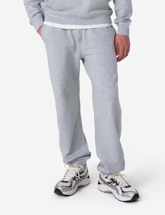 The rapha cotton sweat pants in light grey. these bad boys are made with 100% organic cotton for all-day comfort. with rapha's iconic script logo embroidered on the back pocket and an elastic waistband with a drawcord (perfect for those post-brunch bloats) these are a must-have for any non-serious laid-back wardrobe.    article fit & features —    — material : 100% organic cotton  — two hand pockets  — elasticated waistband with drawcord closure  — script embroidered logo at back pocket  — ribbe Gray Sweats With Elastic Waistband For Streetwear, Cotton Sweatpants For Streetwear With Straight Hem, Athletic Heather Cotton Sweats In Sportswear Style, Gray Streetwear Joggers With Comfort Waistband, Gray Joggers With Comfort Waistband For Streetwear, Gray Cotton Sweats With Side Pockets, Gray Comfort Waistband Joggers For Streetwear, Gray Cotton Sports Sweats, Cotton Joggers For Streetwear With Straight Hem