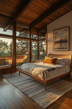 a bed sitting in a bedroom next to large windows