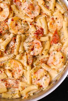 pasta with shrimp and tomato sauce in a pan