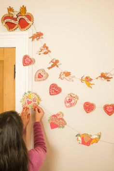 Inspired by scared hearts and Mexican folk art, this garland is full of kitsch and romance. Ten decorative, bejewelled hearts create the three metre garland. 3 metres long. Paper shapes sewn along strong cotton thread. Designed in Glasgow. Screen printed by hand on both sides by talented artisans in Jaipur. Sustainably made from recycled materials. Eco-friendly information • Packaging: Plastic-free, recyclable, recycled, and zero waste. • Product Materials: Biodegradable, plastic-free, recycled, Sewn Garland, Paper Shapes, Heart Painting, Paper Garland, Notebook Gifts, Paper Packaging, Japanese Crafts, Hand Screen Printed, Gifts Cards