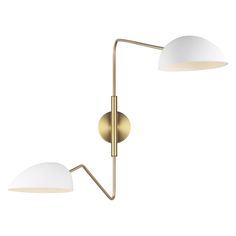 two lights that are next to each other on a white wall and one light is gold