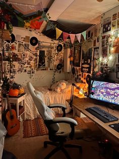 a computer desk with a keyboard and monitor on it in a room filled with decorations