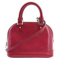 Item Details: Designer: LOUIS VUITTON Retail: N/A Model: Alma BB Style: Satchel/Crossbody Bag Material: Epi Leather Color: Red Made: France Date Code: MI4192 Made Year: 2012 Measurements: L 9.5" H 7" D 4.5" Accessories: No Accessories. Condition Detail: Good - The Item shows signs of use, possibly including rubbed corners, moderate leather tanning, some inside stain marks, and tarnishing hardware. See the listing description for details. Outside: Clean condition. Inside: Dirt marks, signs of use Leather Tanning, Bb Style, Alma Bb, Pre Owned Louis Vuitton, Leather Satchel, Tanning, Louis Vuitton Handbags, Designer Handbags, Satchel