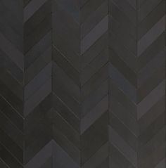 an image of a black wall that looks like herringbones