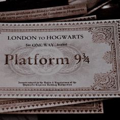 two harry potter hogwarts tickets sitting on top of each other